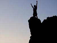 person atop mountain