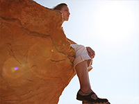 woman sitting on ledge